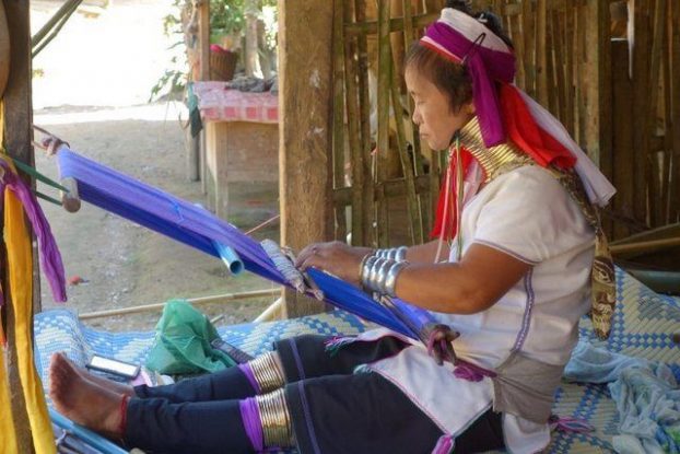 One of the women who sews in a traditional manner
